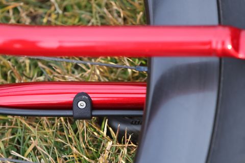 Bolt-on housing guide for brake line on the chainstay