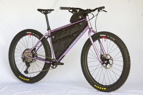Steel bikepacking bike with custom lavender paint scheme